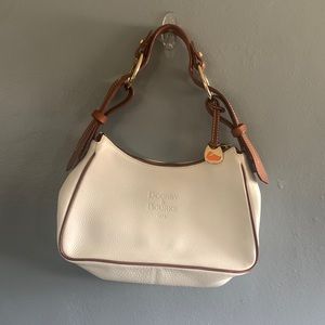Vintage Dooney & Bourke purse – never used!
Pebble white leather and tan trim